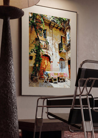 Italian courtyard by Massimo Frascogna framed in a dim room beside a tubular steel chair