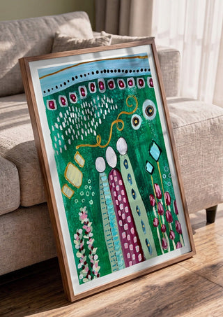 Fairy Tale 2 by Art Anne Lee in a walnut frame leaning against a grey sofa
