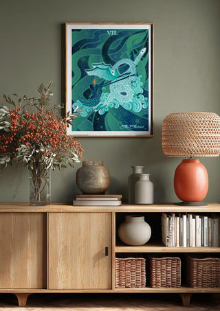 The Chariot by Sciurus tarotus above a wooden sideboard on a sage green wall