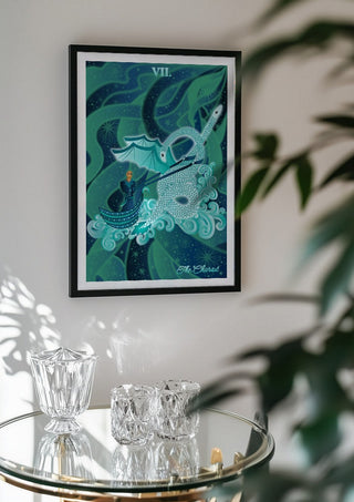 The Chariot by Sciurus tarotus in a black frame above a glass table with crystal glassware