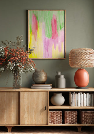 Pinky flow by FridaRit above a wooden sideboard on a sage green wall