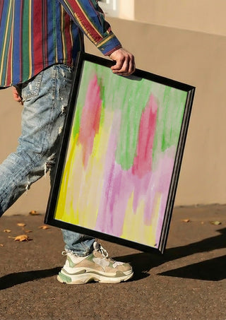 Pinky flow by FridaRit carried in a black frame along a sunny street