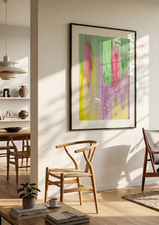 Pinky flow by FridaRit in a black frame in a bright dining room with wooden chairs