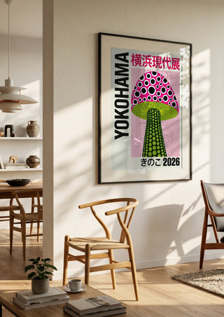 Green Stem Mushroom Poster by Yokohama in a black frame in a bright dining room with wooden chairs