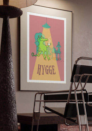 Hygge Crocodile by Elisa Albanelli framed in a dim room beside a tubular steel chair