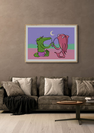 Drinking Buddies by Elisa Albanelli in a light oak frame on a warm grey wall above a brown sofa
