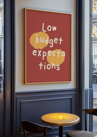 Low Budget Expectations by Jakob Falkenberg in an oak frame on a panelled café wall