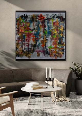 Schmetterling by ullimcart in a black frame on a grey wall above a dark sofa with candlesticks