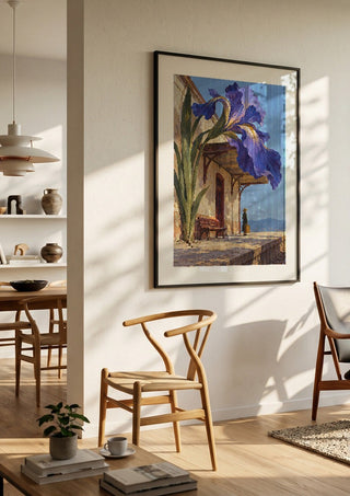 The Station in Bloom by Matthews Gallerie in a black frame in a bright dining room with wooden chairs