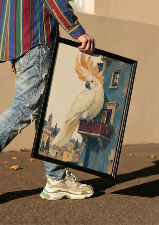 A Balcony of One’s Own by Matthews Gallerie carried in a black frame along a sunny street