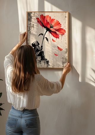 Under a Scarlet Bloom by Matthews Gallerie being hung on a sunlit wall
