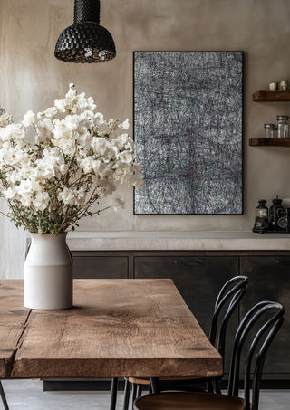 Targeted by Priit Ruttas in a black frame above a rustic table with white flowers