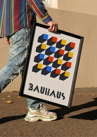 Bauhaus Grid by Neil Stevens carried in a black frame along a sunny street