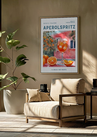 Estate Italiana by Ohkimiko framed above a beige armchair beside a potted plant