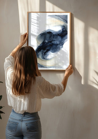 Frozen Light by Anna Dormir being hung on a sunlit wall