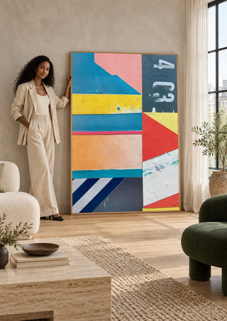 403 by Kareem Rizk as a large canvas standing on the floor of a bright living room by a tall window