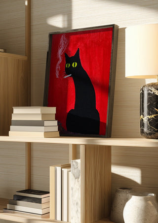 Vadim by Zhan Snow in a dark frame on a wooden shelf beside books and a lamp
