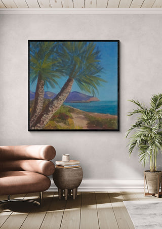 View from Isla Plana to La Azohía, Cartagena, Spain by PaKart in a black frame above a pink armchair beside a potted palm