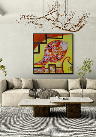 Music Fish by Sunny in a black frame above a beige sofa under a branch chandelier