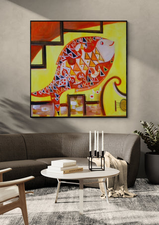 Music Fish by Sunny in a black frame above a grey sofa with a round table and candlesticks