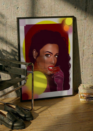The Light is Coming by Sabrina Rosenblatt in a black frame leaning against a concrete wall by a steel chair