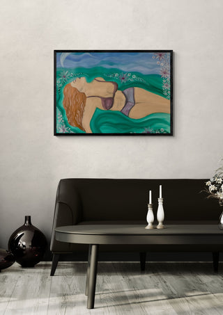 Diva by Carmen Coduri in a black frame above a dark sofa with candlesticks