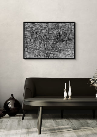Sirius 33 by Priit Ruttas in a black frame above a dark sofa with candlesticks