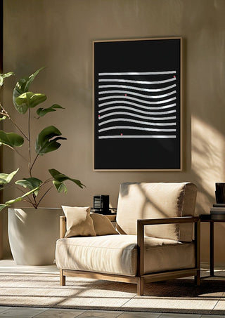 Marbels by Aleksi Allan framed above a beige armchair beside a potted plant