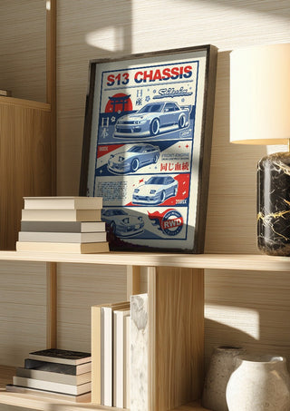 Nissan S13 Chassis by Kaminarirace in a dark frame on a wooden shelf beside books and a lamp