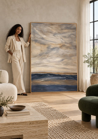 Whispers of Silence by Maya in a tall wooden frame leaning against a wall in a sunlit room