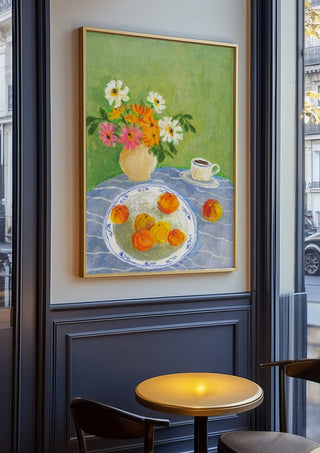 February Zinnias by Deblina Dey in an oak frame on a panelled cafe wall