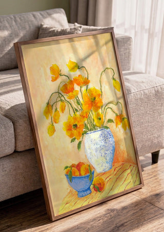 Poppies And Peaches by Deblina Dey in a walnut frame leaning against a grey sofa