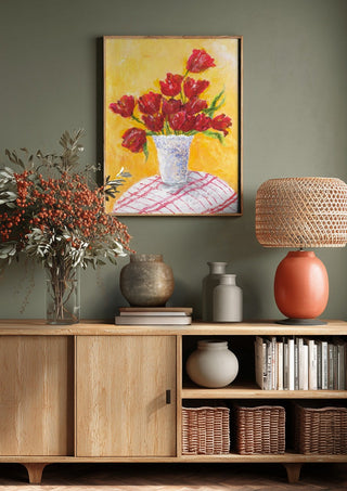 Tulips - II by Deblina Dey above a wooden sideboard on a sage green wall