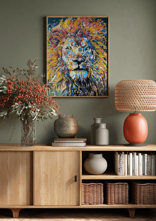 Soul of a Lion by Bibi above a wooden sideboard on a sage green wall