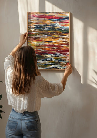 Feelings by Tonia being hung on a sunlit wall