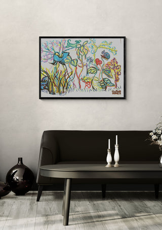 Garden in Bloom by Eva Hartman in a black frame above a dark sofa with white candlesticks