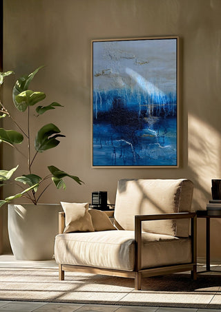 Rising Light by Sabine Halbrock framed above a beige armchair beside a potted plant