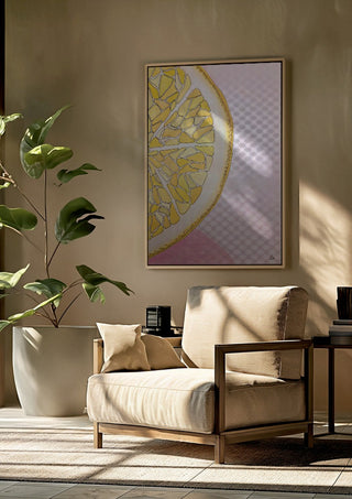 Lemon Slice by L.OE. Art framed above a beige armchair beside a potted plant