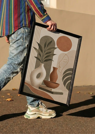 Earth Tone Abstract Still Life by TimlessArtworks carried in a black frame along a sunny street