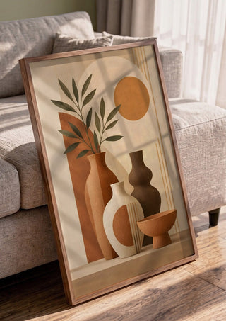 Earth Tone Still Life with Ceramic Vases by TimlessArtworks in a walnut frame leaning against a grey sofa