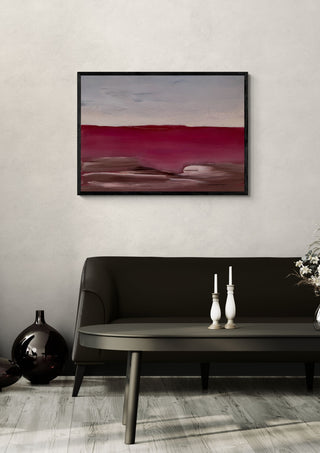 Blood Red Line by Marina Agre in a black frame above a dark sofa with white candlesticks