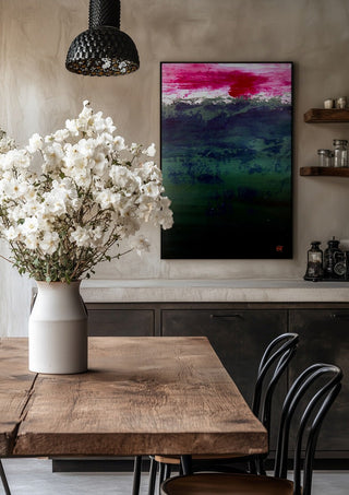 Emerald and Carmine by Marina Agre in a black frame above a rustic table with white flowers