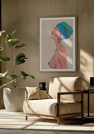 Melanin & Moonlight by Bibi framed above a beige armchair beside a potted plant