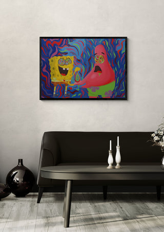 Squeezed drop theory by Luigi Monti in a black frame above a dark sofa with white candlesticks