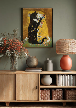 Kitty Kiss by Dikhotomy above a wooden sideboard on a sage green wall