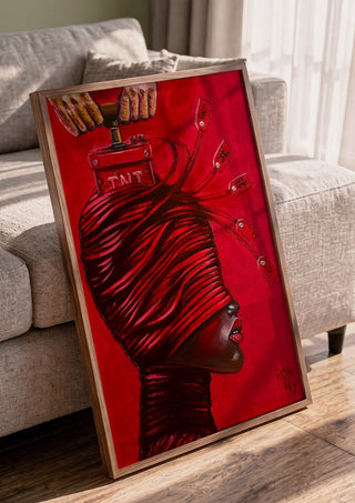 TNT by Ronny Simon in a walnut frame leaning against a grey sofa
