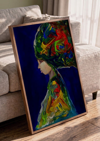 The Wind by Ronny Simon in a walnut frame leaning against a grey sofa