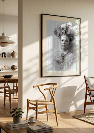Klara by Bettinafloorphoto in a black frame in a bright dining room with wooden chairs