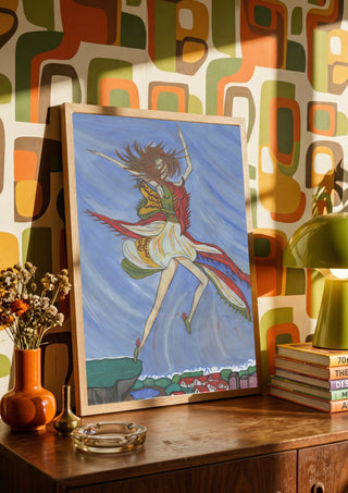 As soon as I can fly by A Sleepy Spirit Art in a wooden frame on a sideboard against retro patterned wallpaper