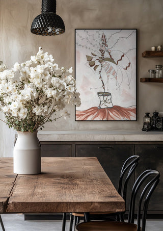 Earth Fairy by A Sleepy Spirit Art in a black frame above a rustic table with white flowers